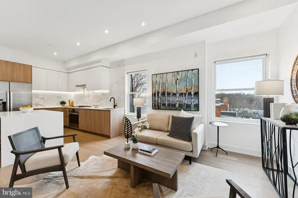 a view of kitchen with furniture and wooden floor