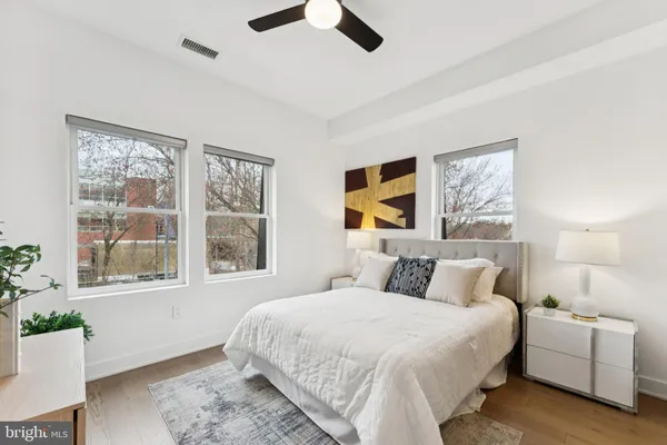 a bedroom with a bed and a couch