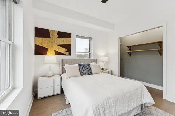 a bedroom with a bed and a dresser