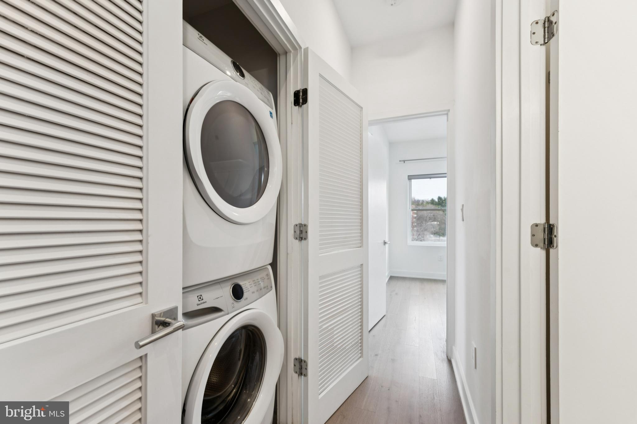 4017 Davis Place Northwest, Unit 7 Washington, DC 20007 - Photo 20 of 39 a view of a hallway with washer and dryer