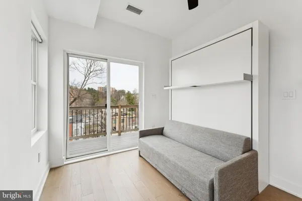 a view of balcony with wooden floor