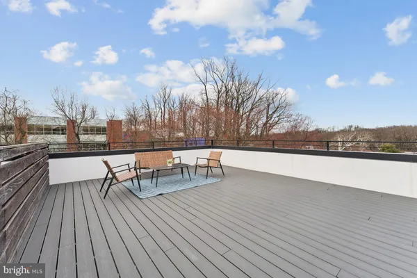 a view of roof deck with patio