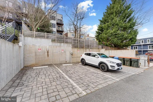 a front view of a building with a yard