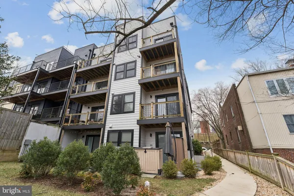 a view of a building with a tree