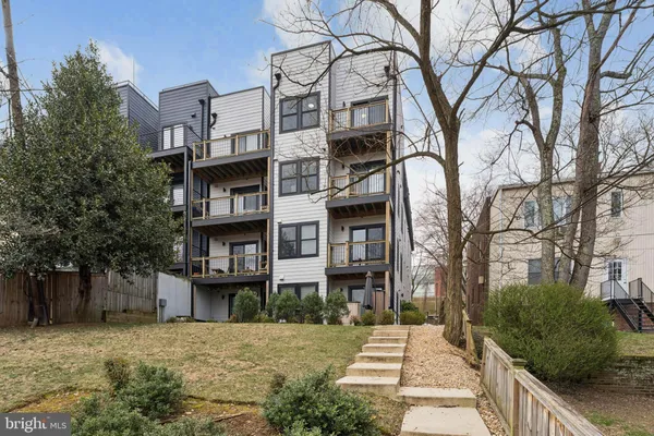 a picture of a park with furniture and a potted plant