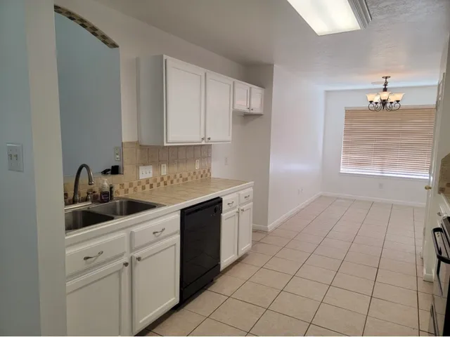 a kitchen with a sink and cabinets