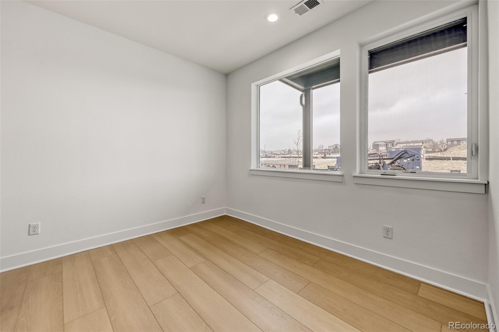 665 Skyhook Street Erie, CO 80516 - Photo 5 of 20 an empty room with a window