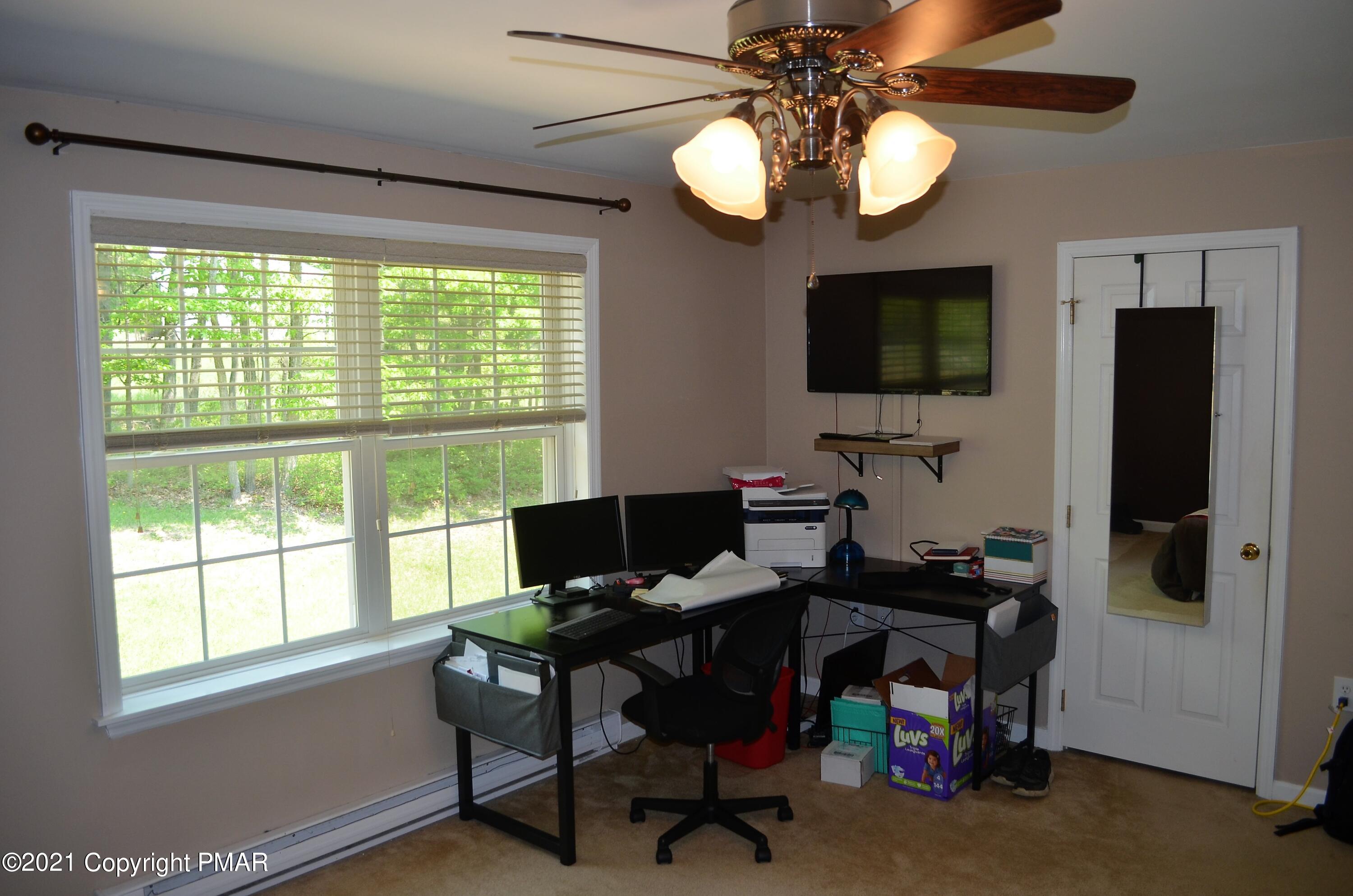 218 Nosirrah Road Albrightsville, PA 18210 - Photo 13 of 32 a view of a workspace with furniture and a window