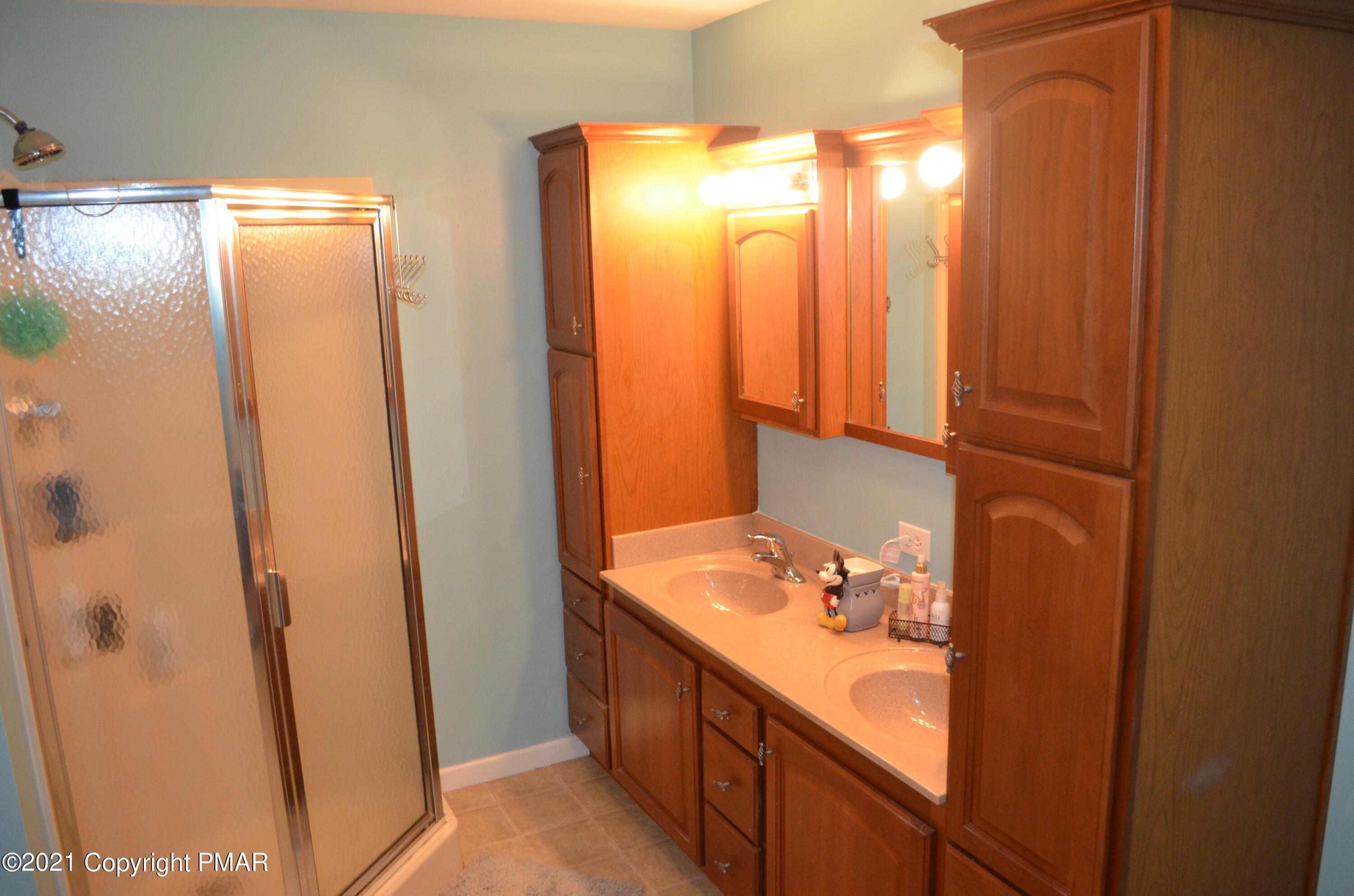 218 Nosirrah Road Albrightsville, PA 18210 - Photo 14 of 32 a bathroom with a double vanity sink and a mirror