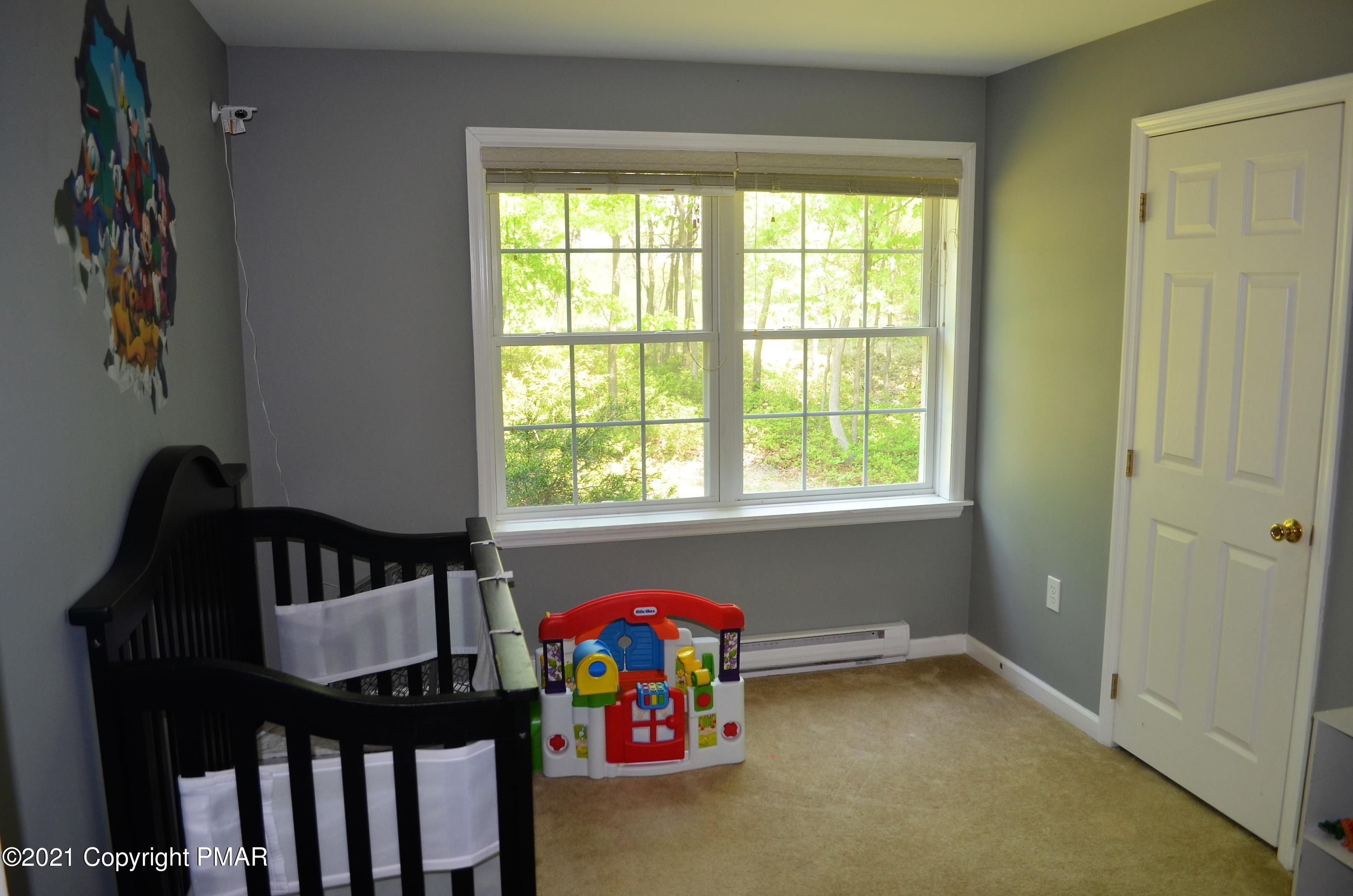 218 Nosirrah Road Albrightsville, PA 18210 - Photo 16 of 32 a bedroom with a bed and a window