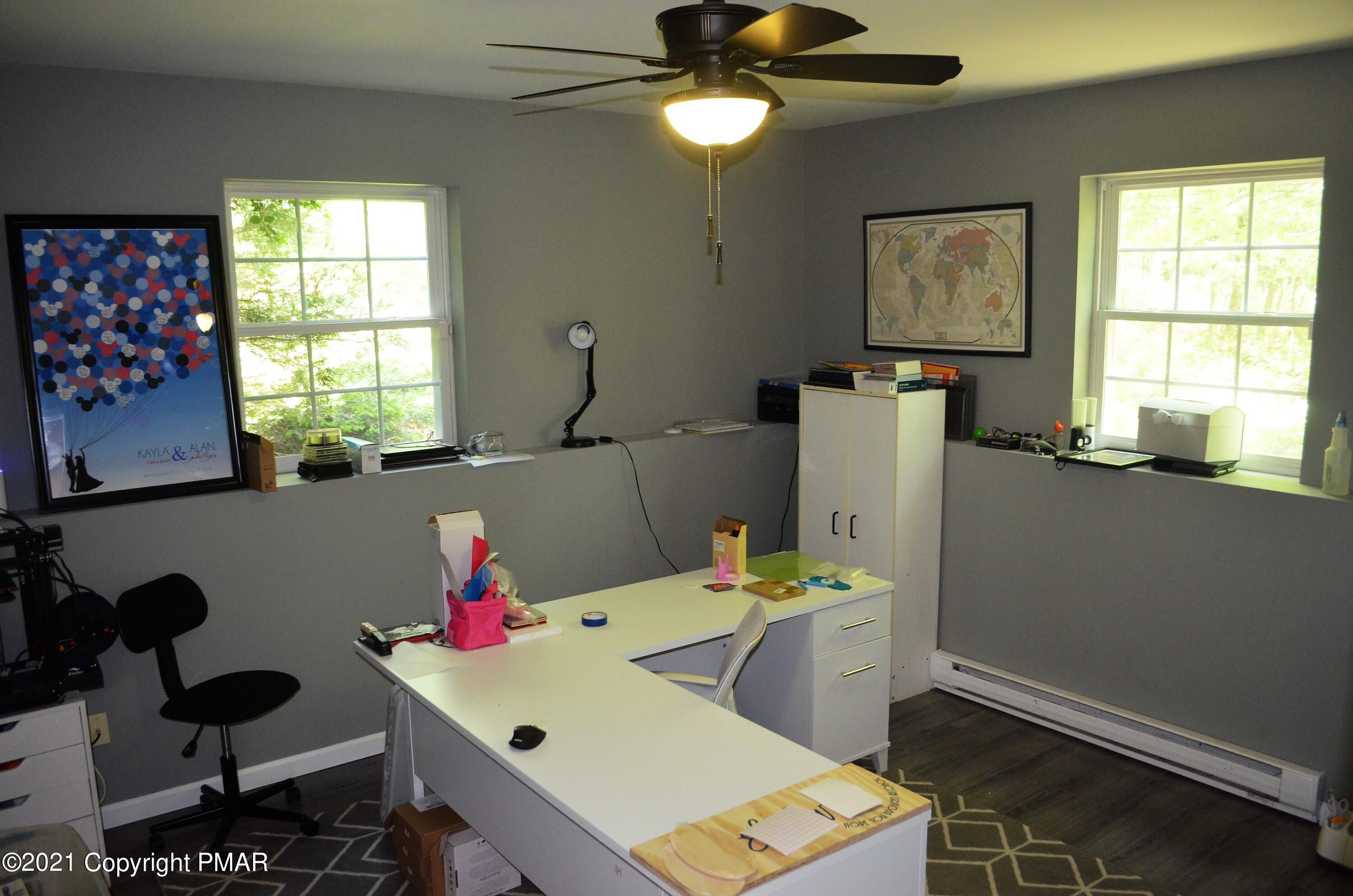 218 Nosirrah Road Albrightsville, PA 18210 - Photo 24 of 32 a room with furniture a chandelier and a window