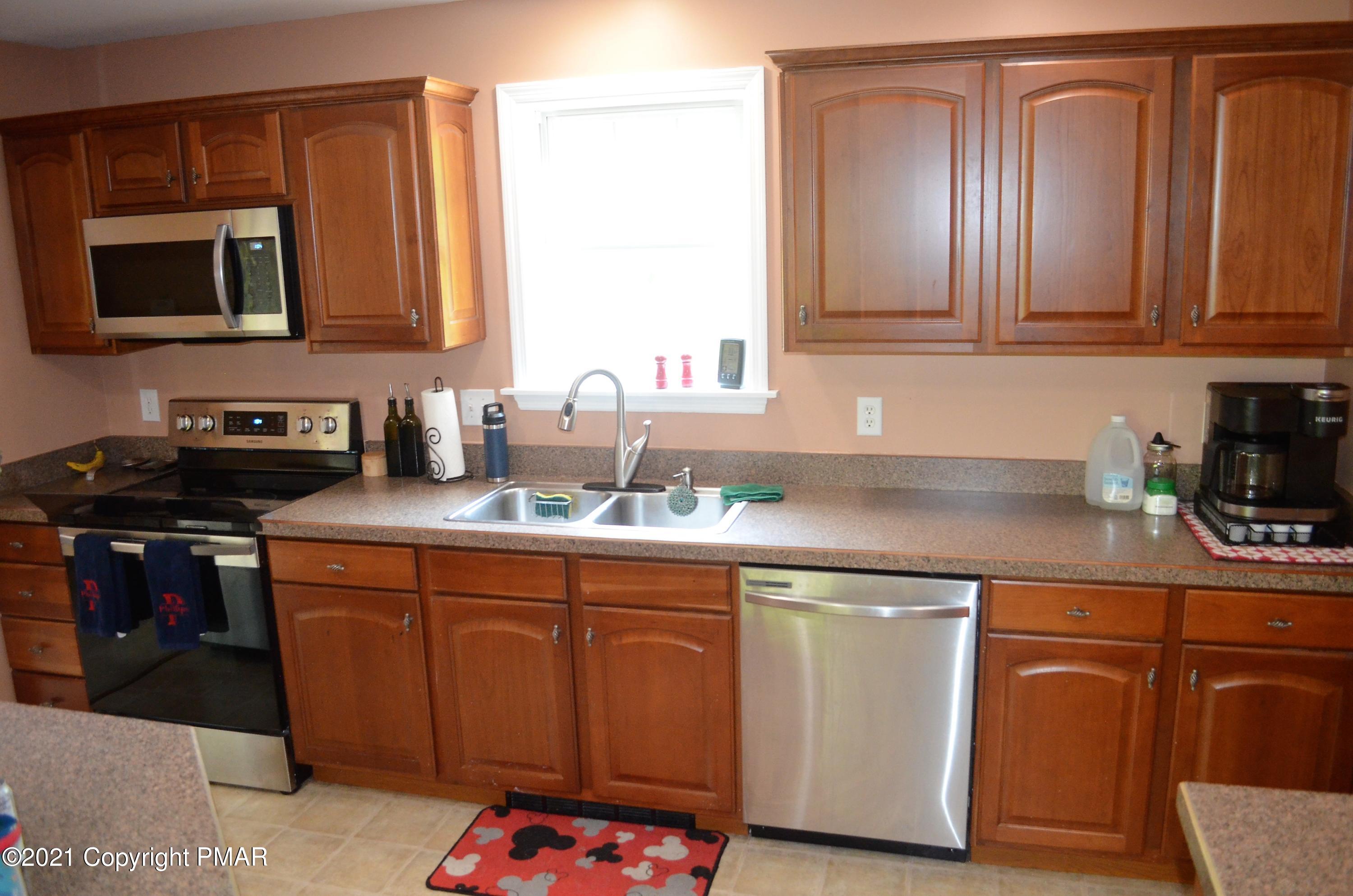 218 Nosirrah Road Albrightsville, PA 18210 - Photo 6 of 32 a kitchen with stainless steel appliances granite countertop a sink stove and microwave