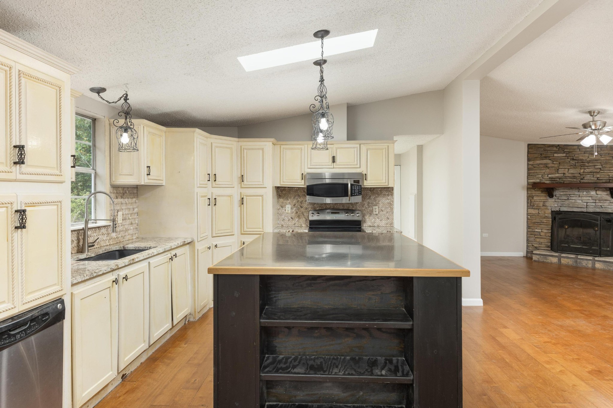 339 Oak Tree Road Ringgold, GA 30736 - Photo 11 of 31 a kitchen with kitchen island a sink stove and refrigerator