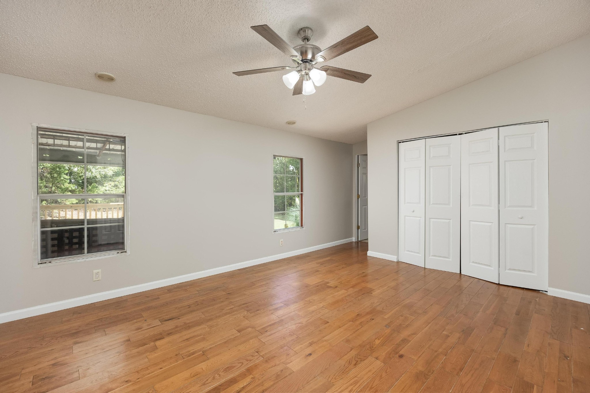 339 Oak Tree Road Ringgold, GA 30736 - Photo 15 of 31 a view of an empty room with wooden floor and a window