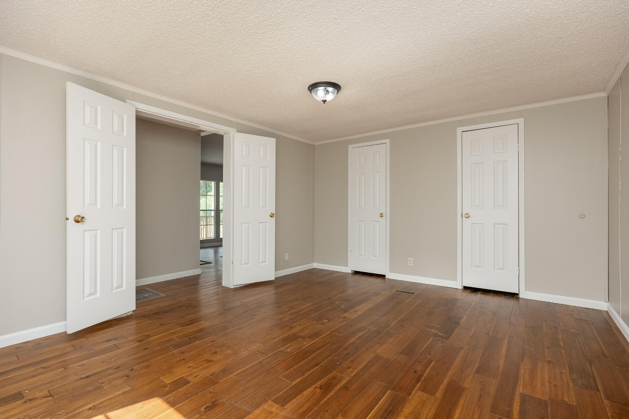 339 Oak Tree Road Ringgold, GA 30736 - Photo 18 of 31 a view of an empty room with wooden floor