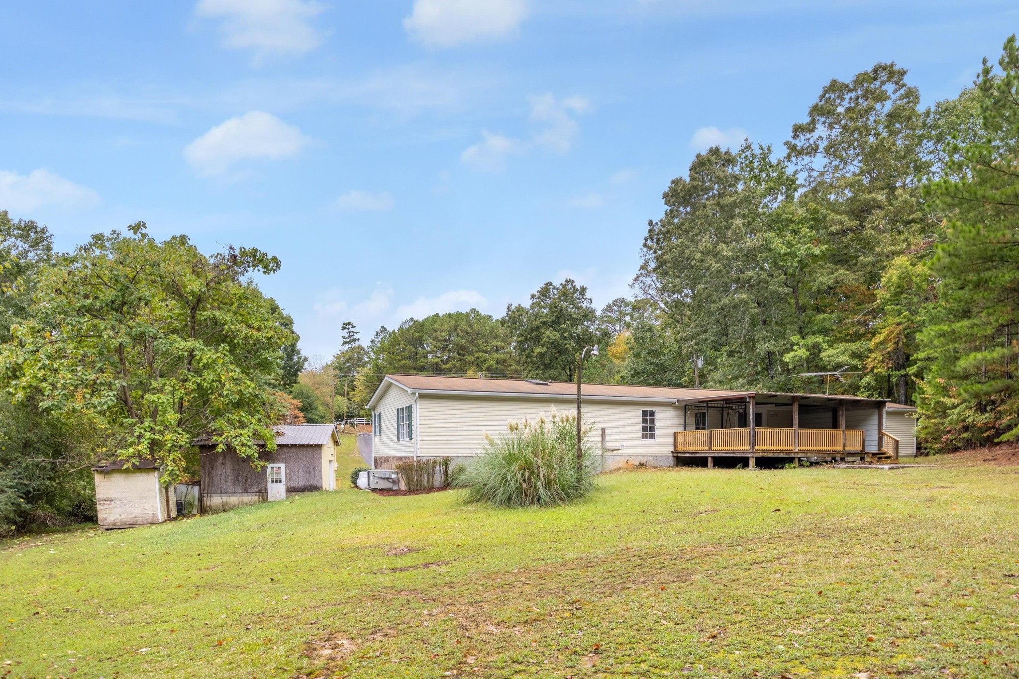 339 Oak Tree Road Ringgold, GA 30736 - Photo 22 of 31 a front view of a house with a garden and trees