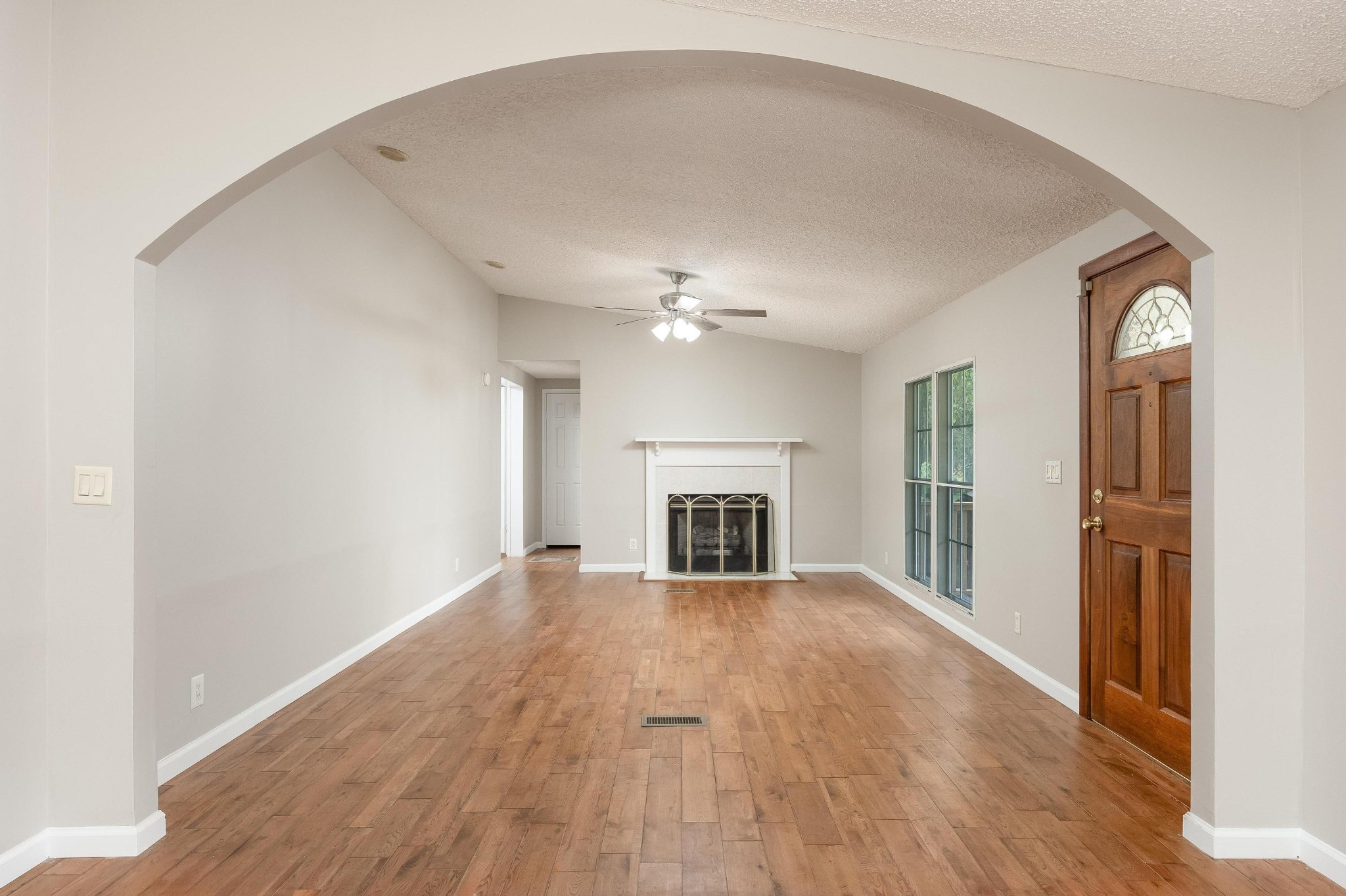 339 Oak Tree Road Ringgold, GA 30736 - Photo 4 of 31 a view of a livingroom with a ceiling fan window and a fireplace