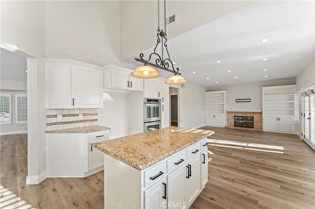 28241 Tamarack Lane Saugus, CA 91390 - Photo 13 of 41 a kitchen with stainless steel appliances granite countertop a sink stove and refrigerator