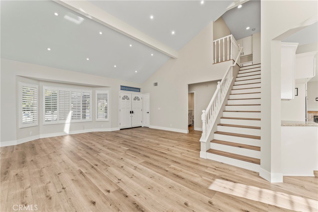 28241 Tamarack Lane Saugus, CA 91390 - Photo 18 of 41 an empty room with wooden floor and stairs