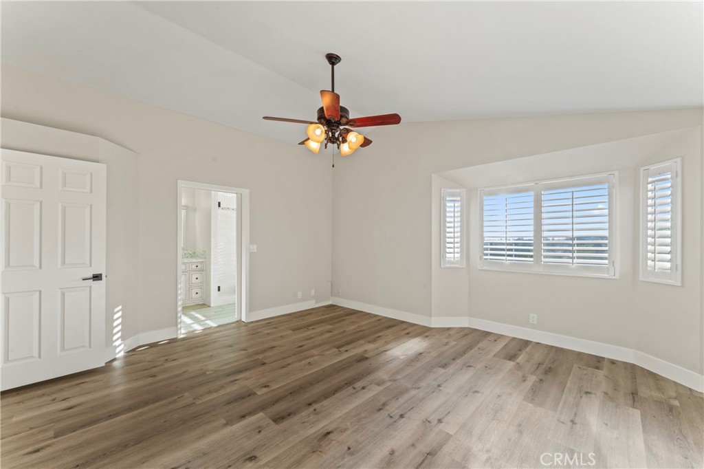 28241 Tamarack Lane Saugus, CA 91390 - Photo 20 of 41 a view of an empty room with wooden floor and a window