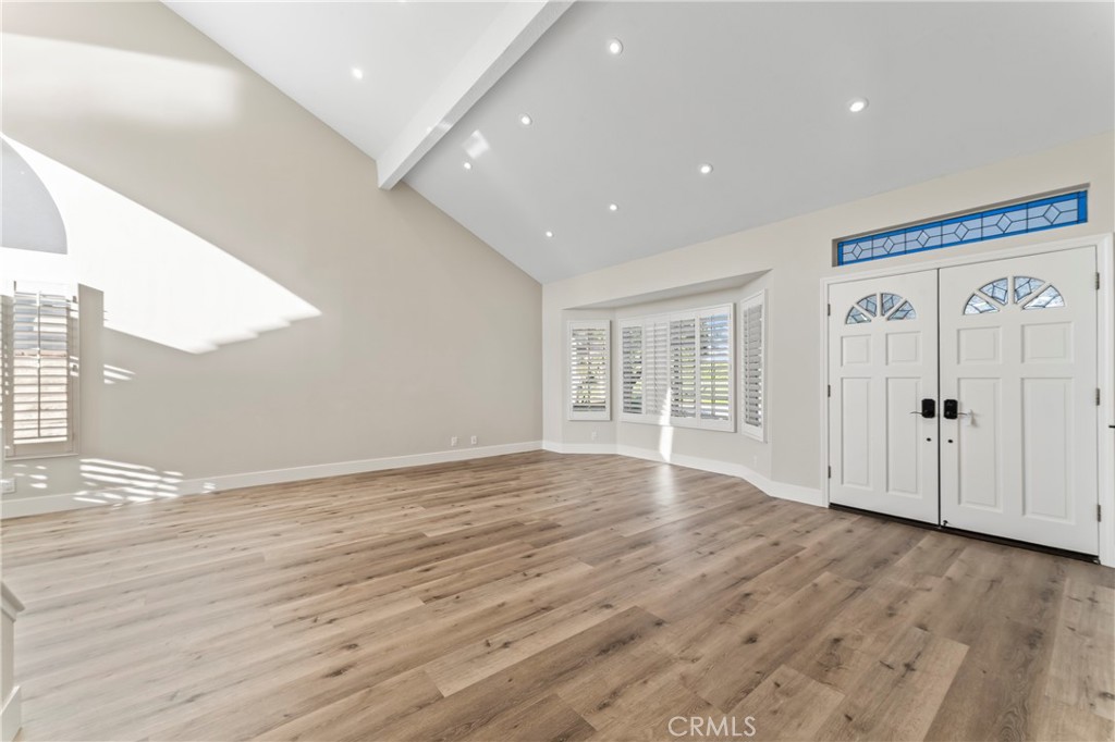 28241 Tamarack Lane Saugus, CA 91390 - Photo 8 of 41 an empty room with wooden floor and windows