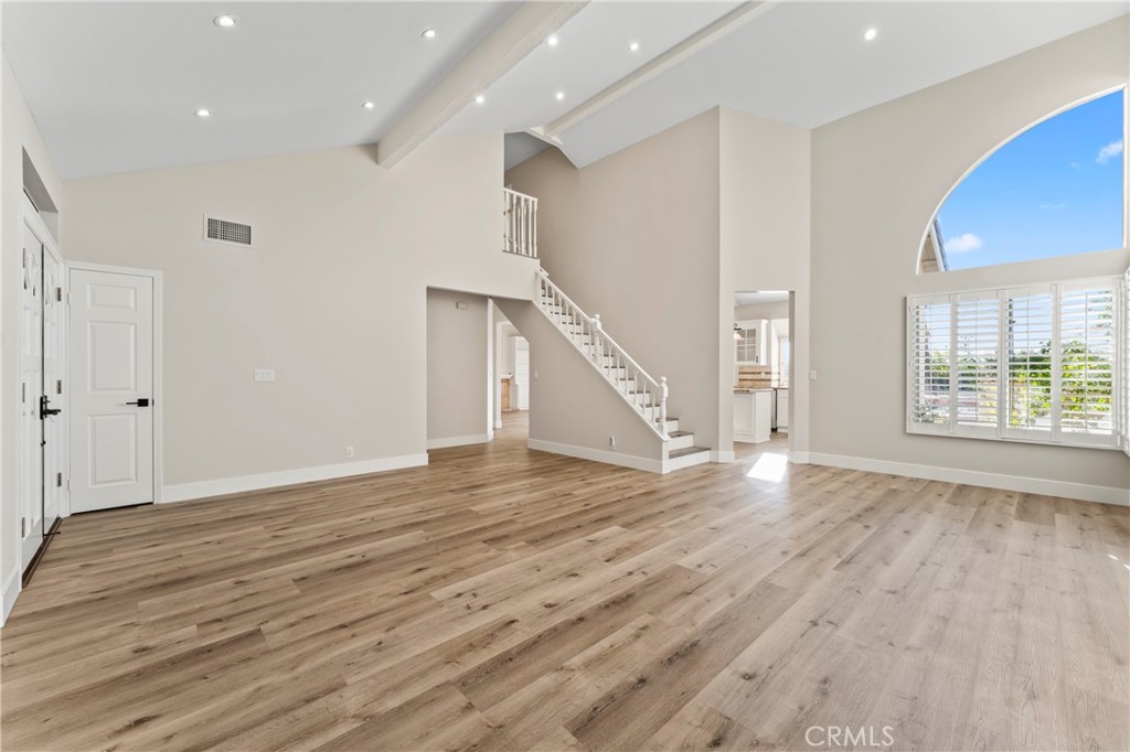 28241 Tamarack Lane Saugus, CA 91390 - Photo 9 of 41 a view of an empty room with wooden floor and a window