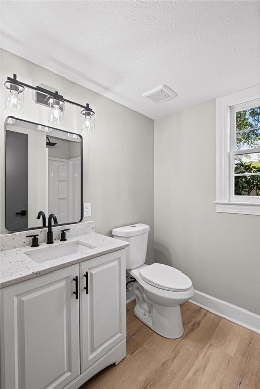 7 East Creekview Drive Southwest Rome, GA 30165 - Photo 32 of 43 a bathroom with a granite countertop sink toilet and mirror