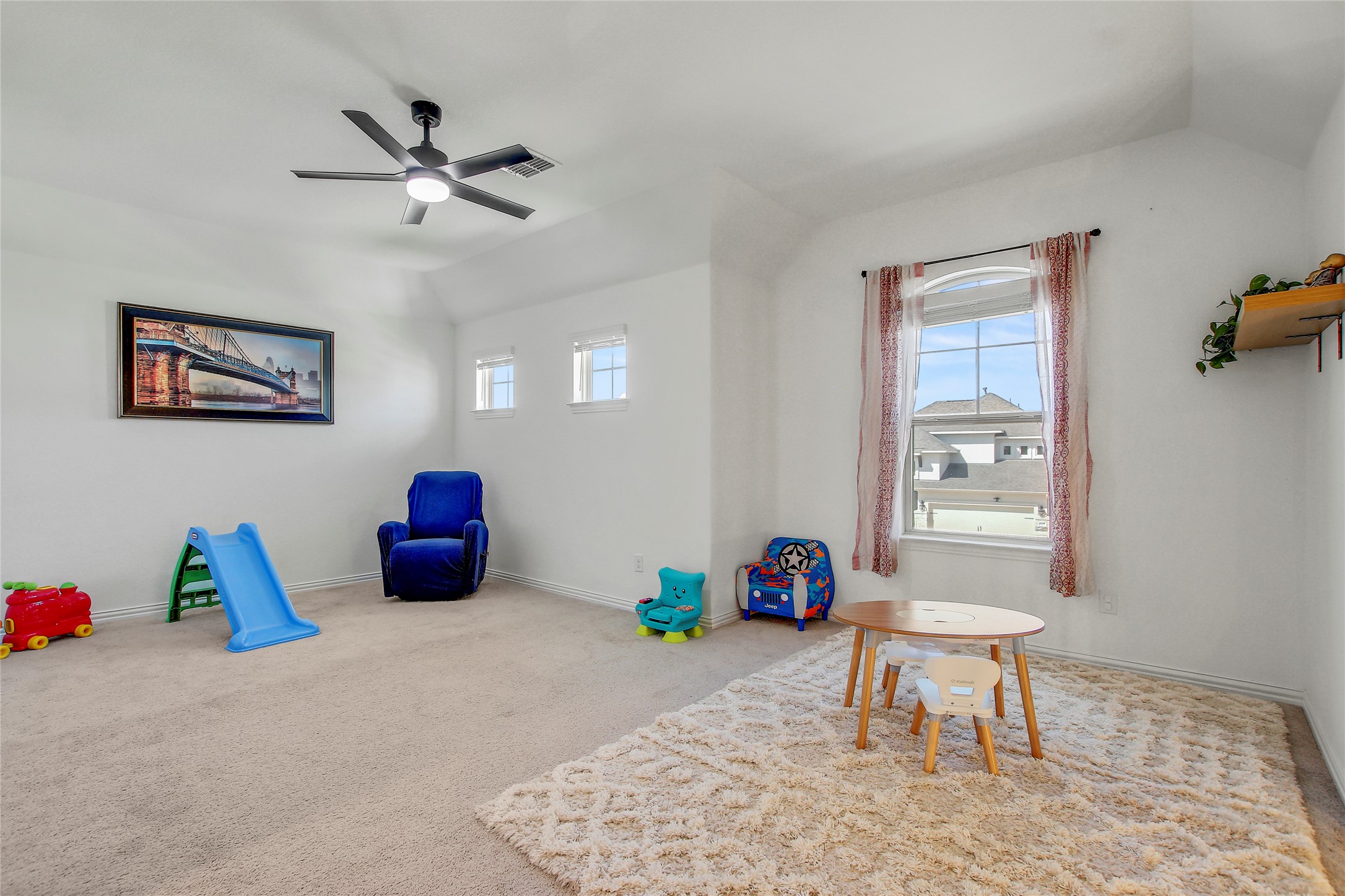 104 Millbend Road Georgetown, TX 78633 - Photo 31 of 40 A spacious and cheerful play area features abundant natural light, creating an inviting atmosphere for creativity.