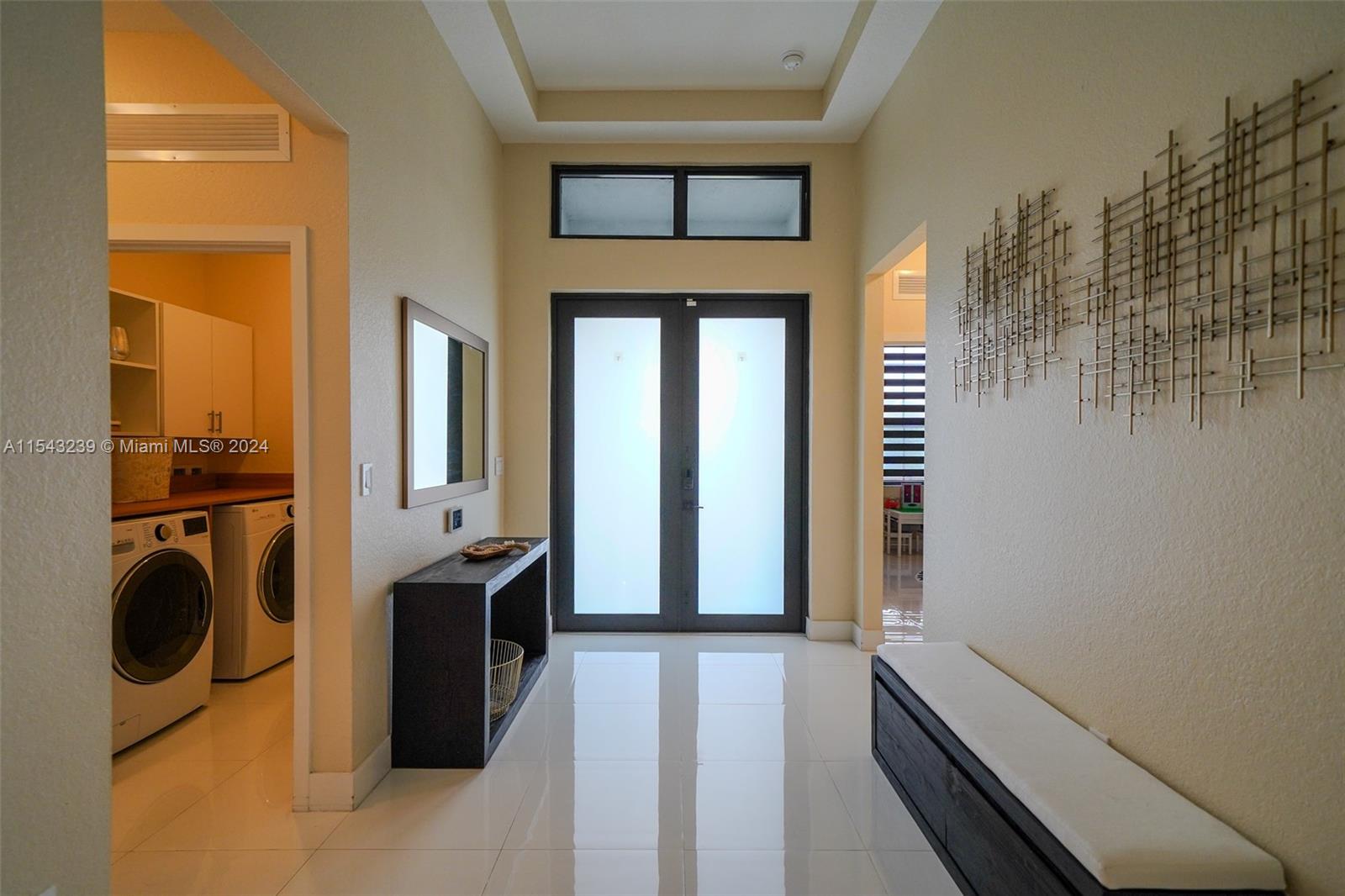 14570 Southwest 19th Street Miami, FL 33175 - Photo 11 of 30 a view of a hallway with washer and dryer