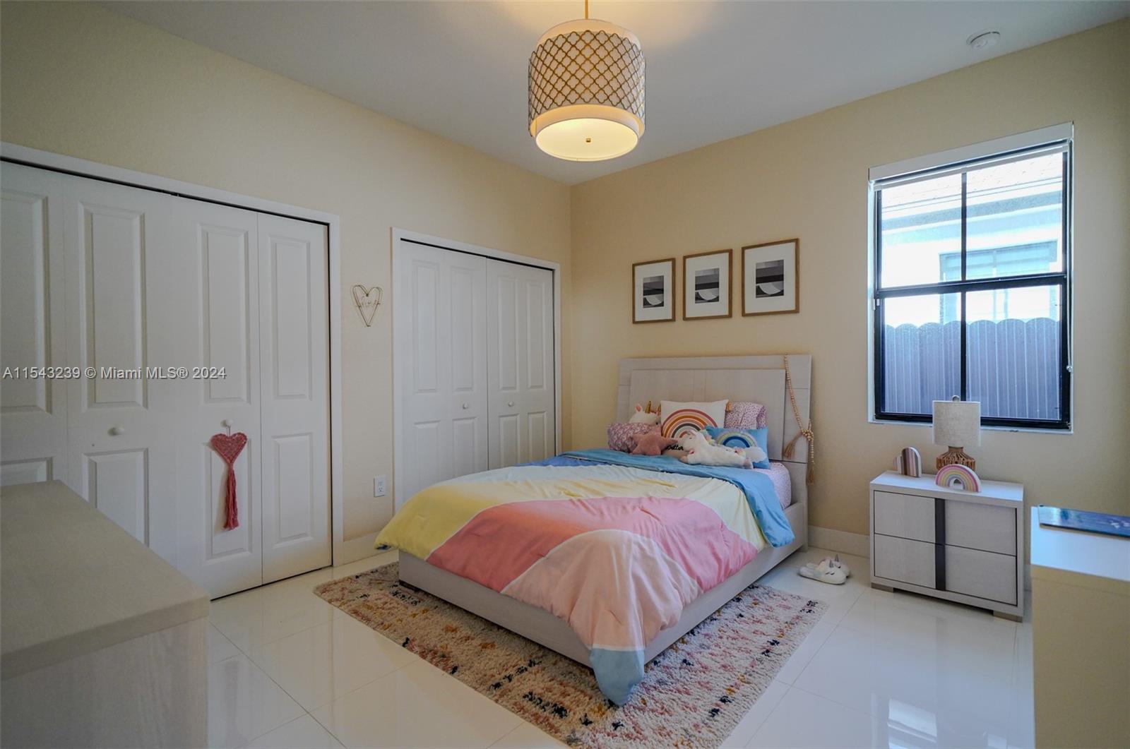 14570 Southwest 19th Street Miami, FL 33175 - Photo 17 of 30 a bedroom with a bed and window