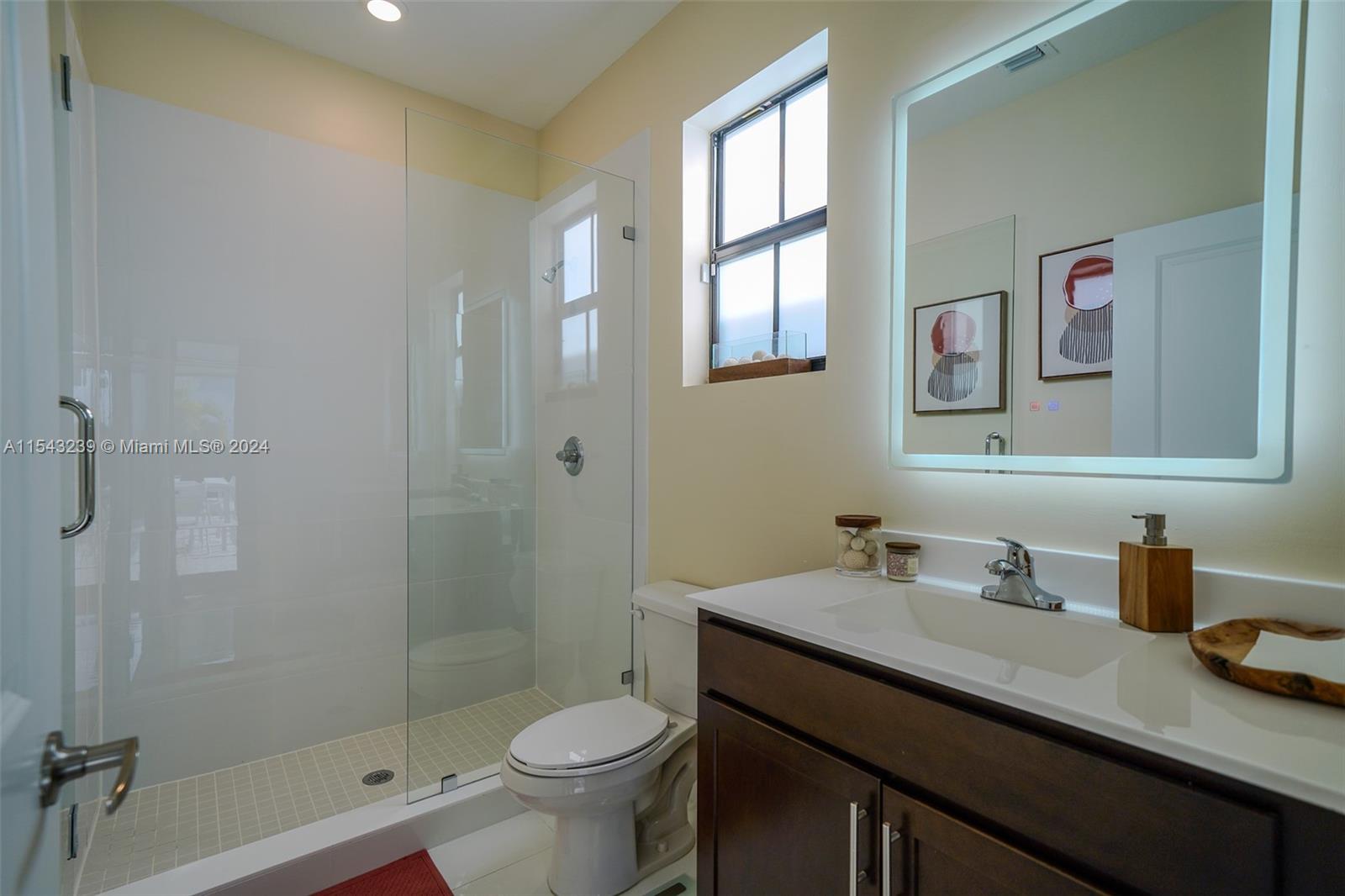 14570 Southwest 19th Street Miami, FL 33175 - Photo 20 of 30 a bathroom with a sink a toilet and shower