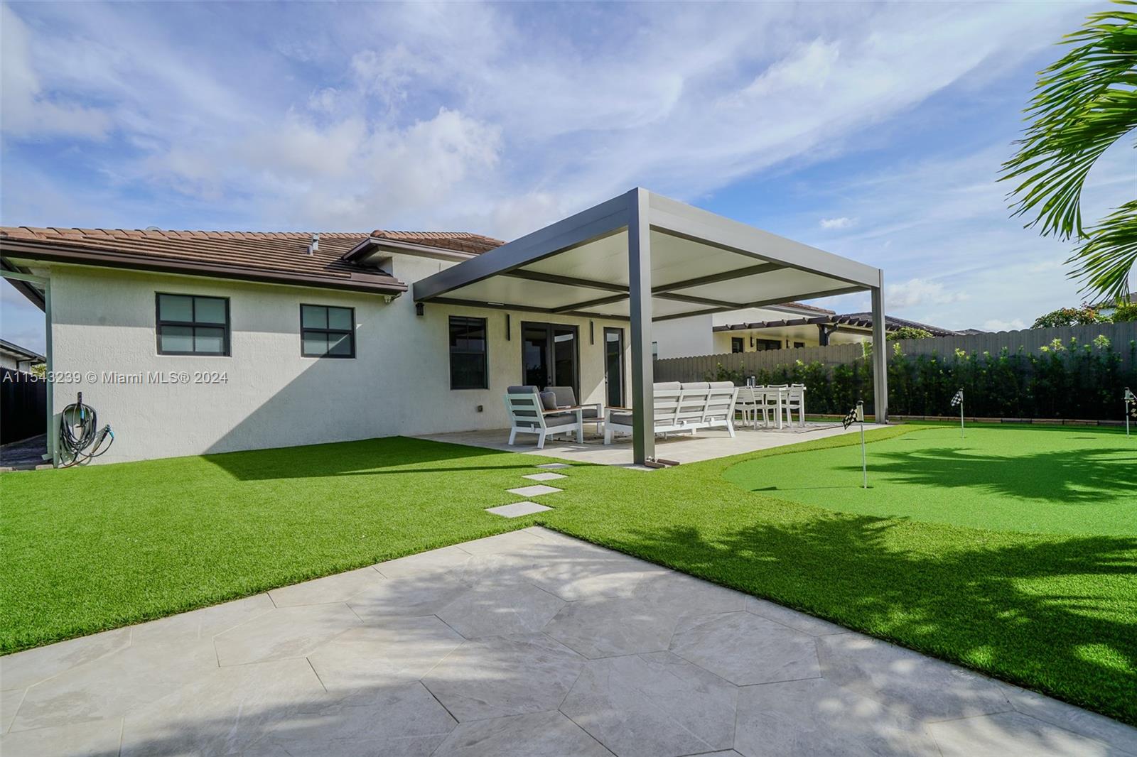 14570 Southwest 19th Street Miami, FL 33175 - Photo 22 of 30 a view of a house with backyard and porch