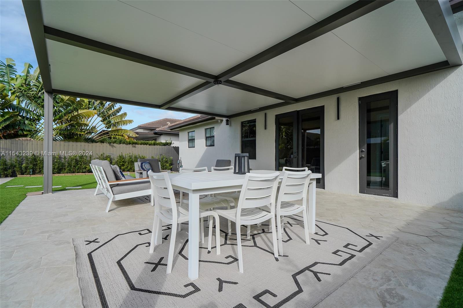 14570 Southwest 19th Street Miami, FL 33175 - Photo 24 of 30 a view of a patio with table and chairs and potted plants