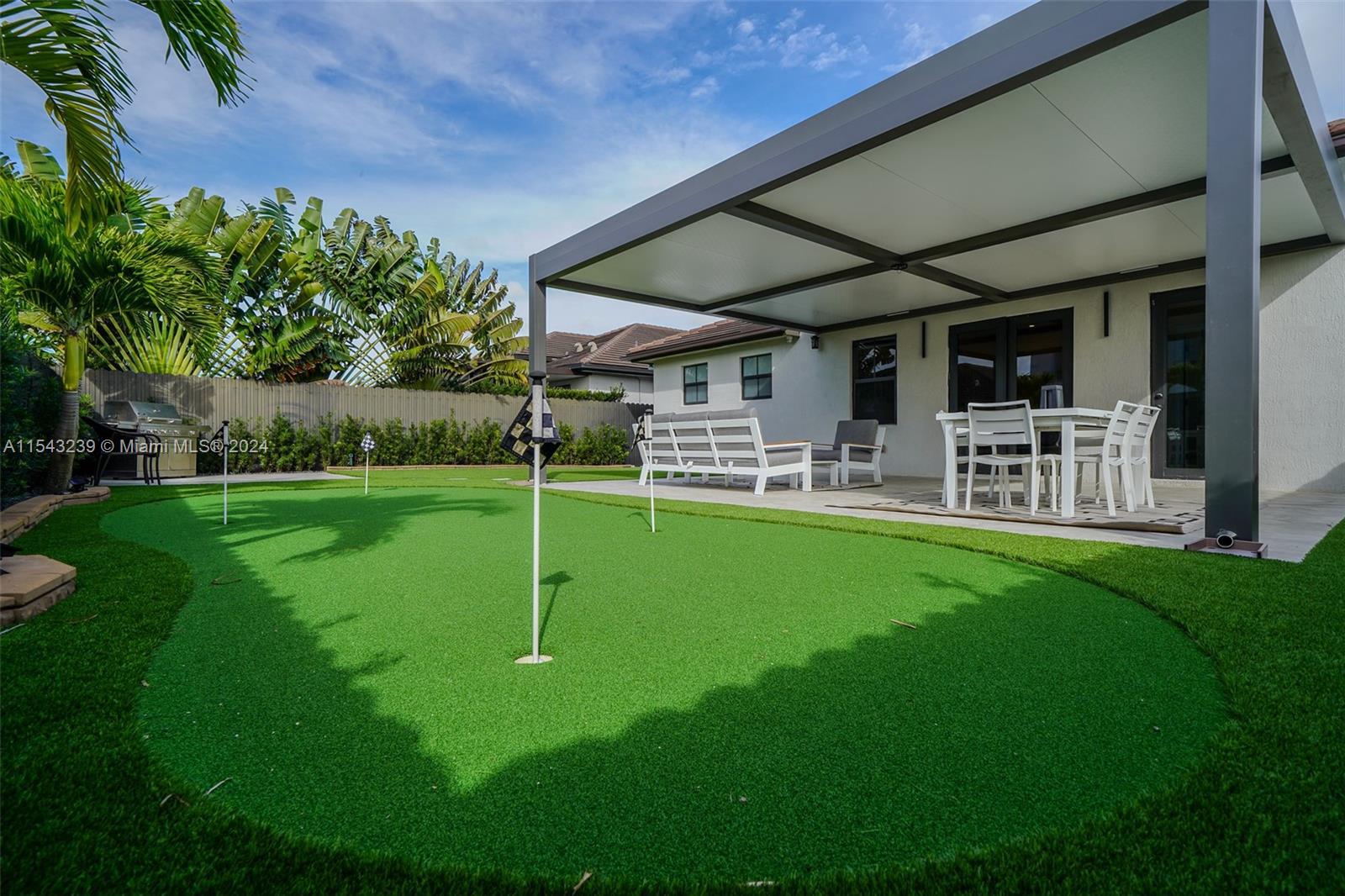 14570 Southwest 19th Street Miami, FL 33175 - Photo 25 of 30 a view of a house and a backyard
