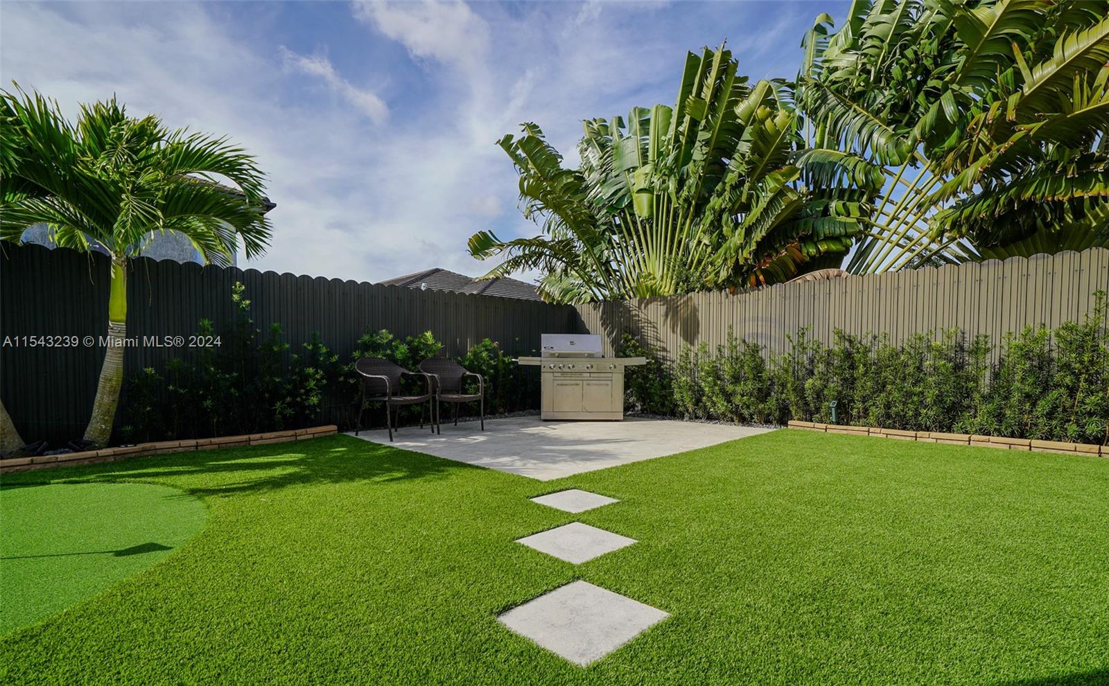 14570 Southwest 19th Street Miami, FL 33175 - Photo 26 of 30 a view of a backyard with a garden