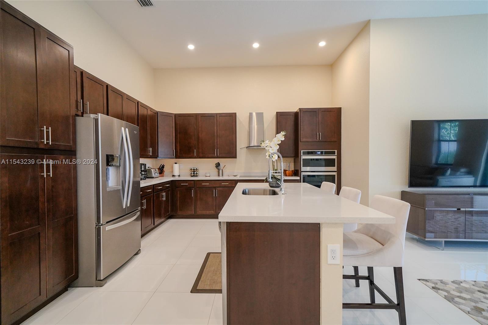 14570 Southwest 19th Street Miami, FL 33175 - Photo 5 of 30 a large kitchen with kitchen island a counter top stainless steel appliances and cabinets