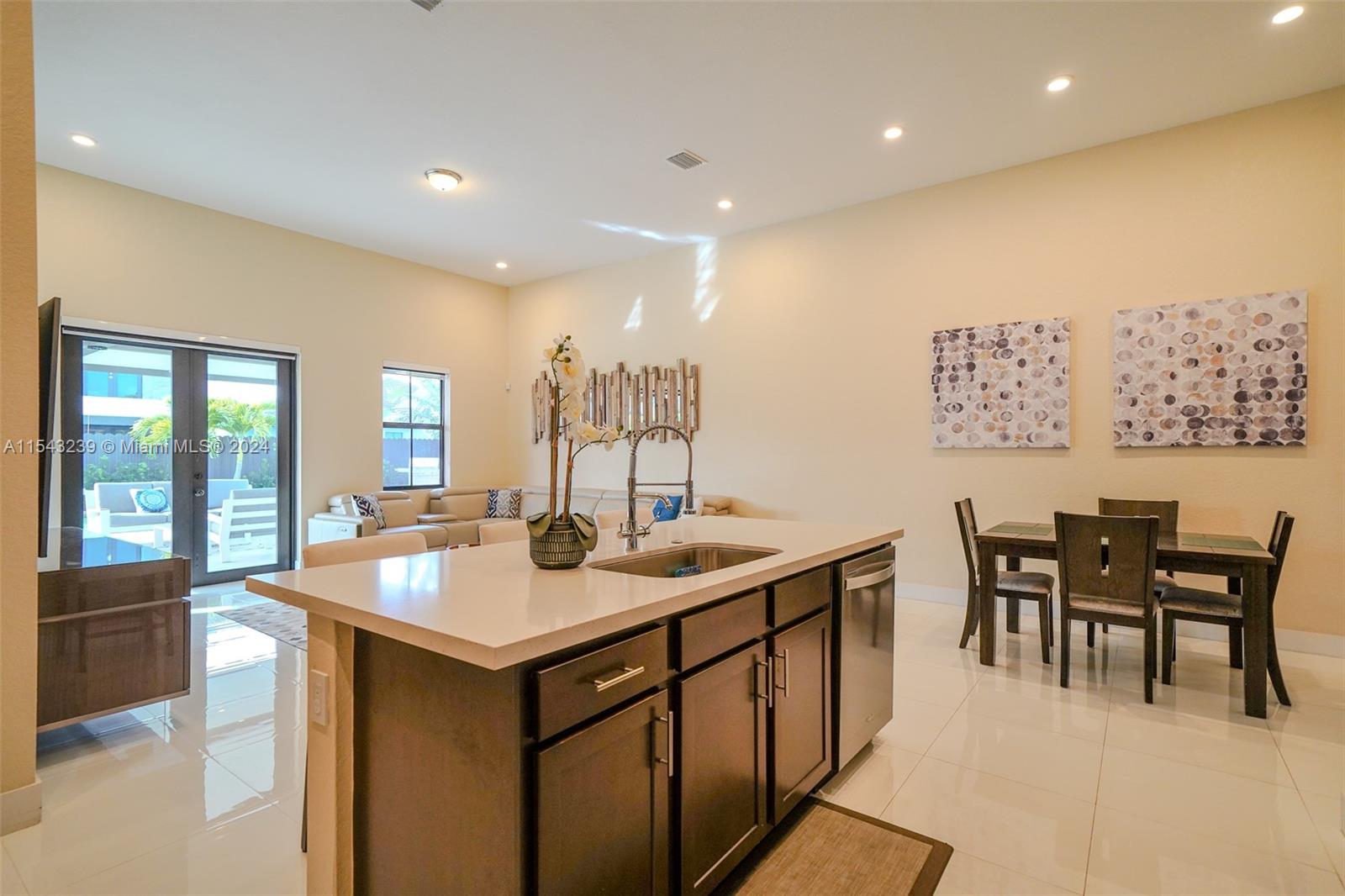 14570 Southwest 19th Street Miami, FL 33175 - Photo 6 of 30 a view of a kitchen area with dining table and chairs