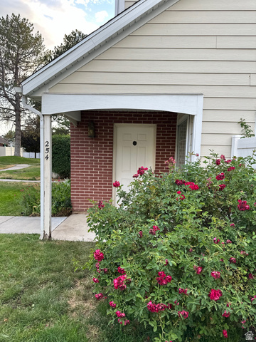 254 Meadow Lane Centerville, UT 84014 - Photo 2 of 34 Entryway featuring red brick facade and a covered porch