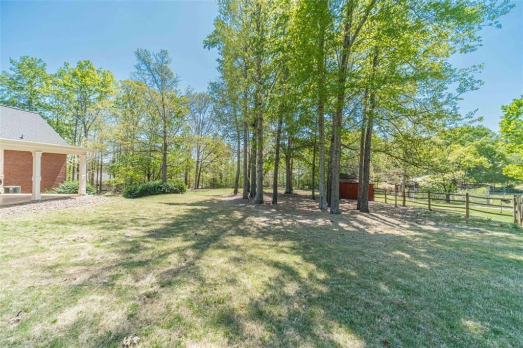 1925 Jesse Cronic Road Braselton, GA 30517 - Photo 54 of 58 a view of a yard with plants and trees
