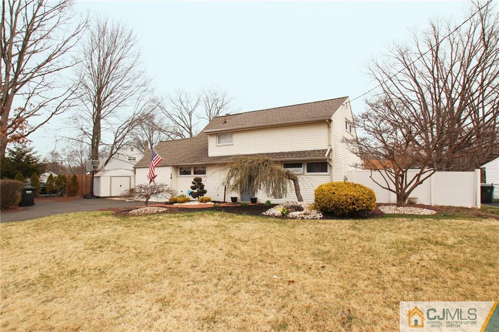 16 Ridge Road Old Bridge, NJ 08857 - Photo 1 of 22 a view of a house with a yard covered in snow