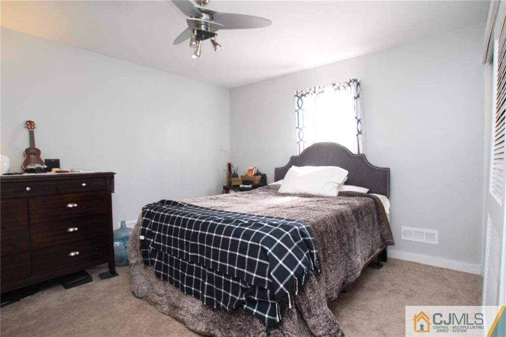 16 Ridge Road Old Bridge, NJ 08857 - Photo 14 of 22 a bedroom with a bed and a window