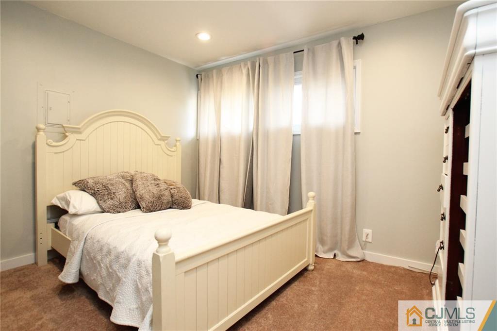 16 Ridge Road Old Bridge, NJ 08857 - Photo 15 of 22 a bedroom with a bed and a mirror