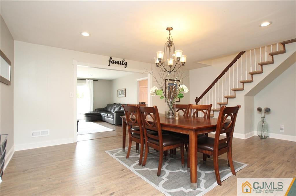 16 Ridge Road Old Bridge, NJ 08857 - Photo 6 of 22 a view of a dining room with furniture and wooden floor