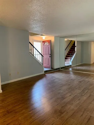 a view of entryway with wooden floor