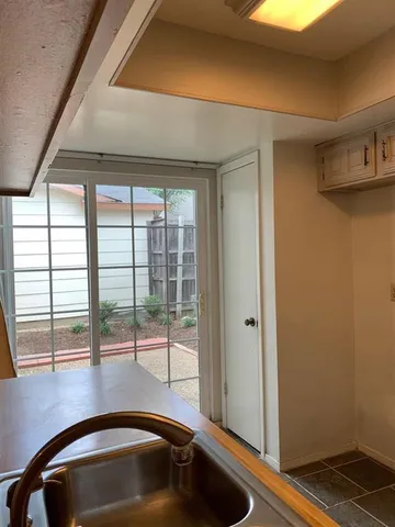 a kitchen with a sink and tub