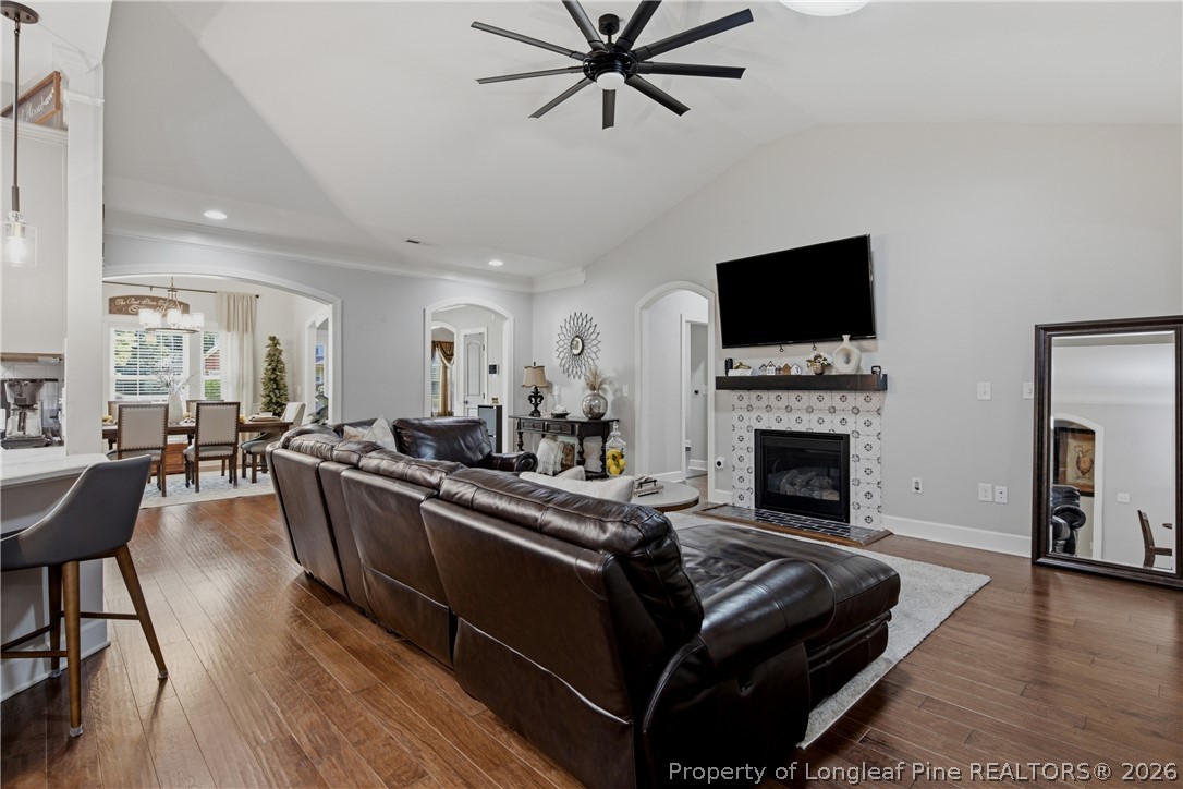 148 Heatherspring Way Spring Lake, NC 28390 - Photo 12 of 50 a living room with furniture a flat screen tv and a fireplace