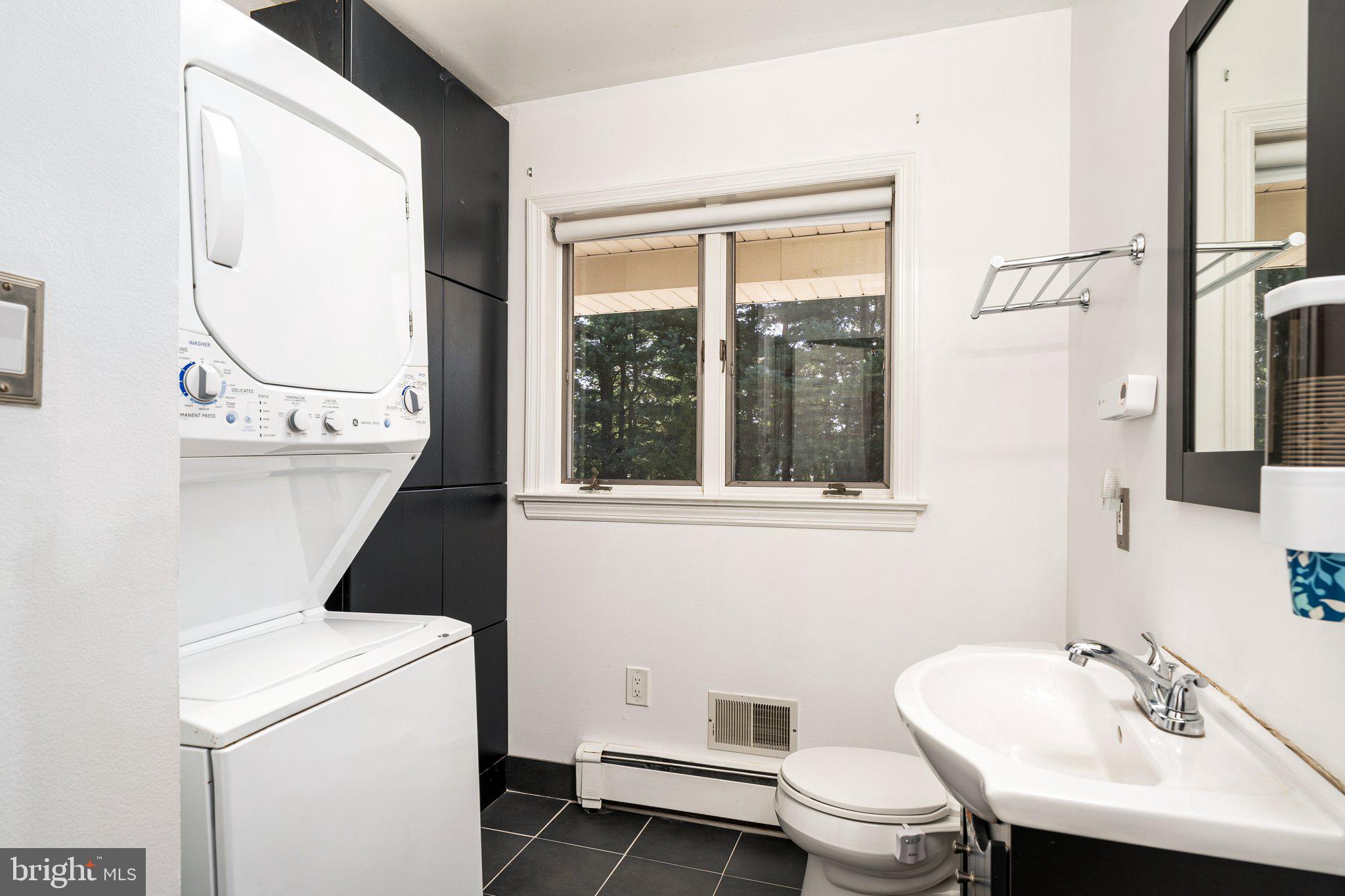 87 Bordentown Chesterfield Road Chesterfield, NJ 08515 - Photo 13 of 49 a bathroom with a sink a toilet and a mirror