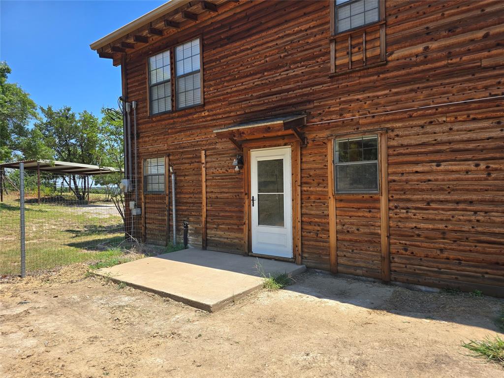 3505 Farmer Road Azle, TX 76020 - Photo 35 of 40 Open back patio near the kitchen, and dirt packed and ready for your own offset smoker or potted plants!