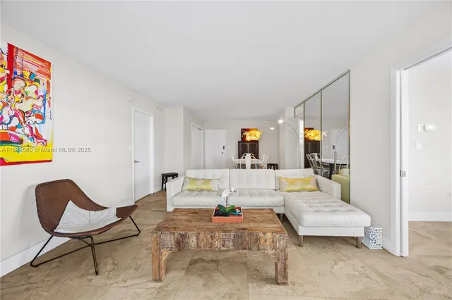 a living room with furniture and a table