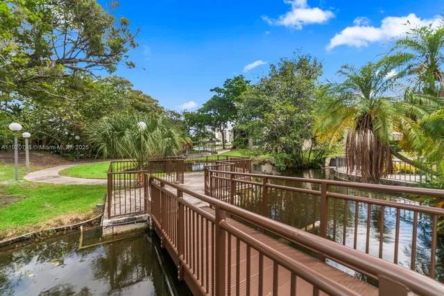 a view of a wooden deck with a big yard